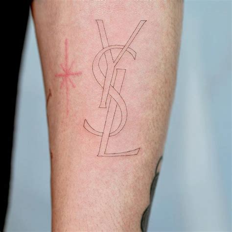 ysl tattoo meaning|YSL tattoo scraped off.